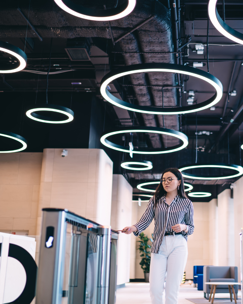 woman entering a building using a secure access controller system